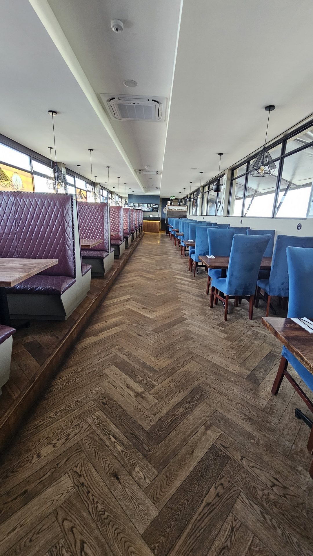 Herringbone floor and quilted booths